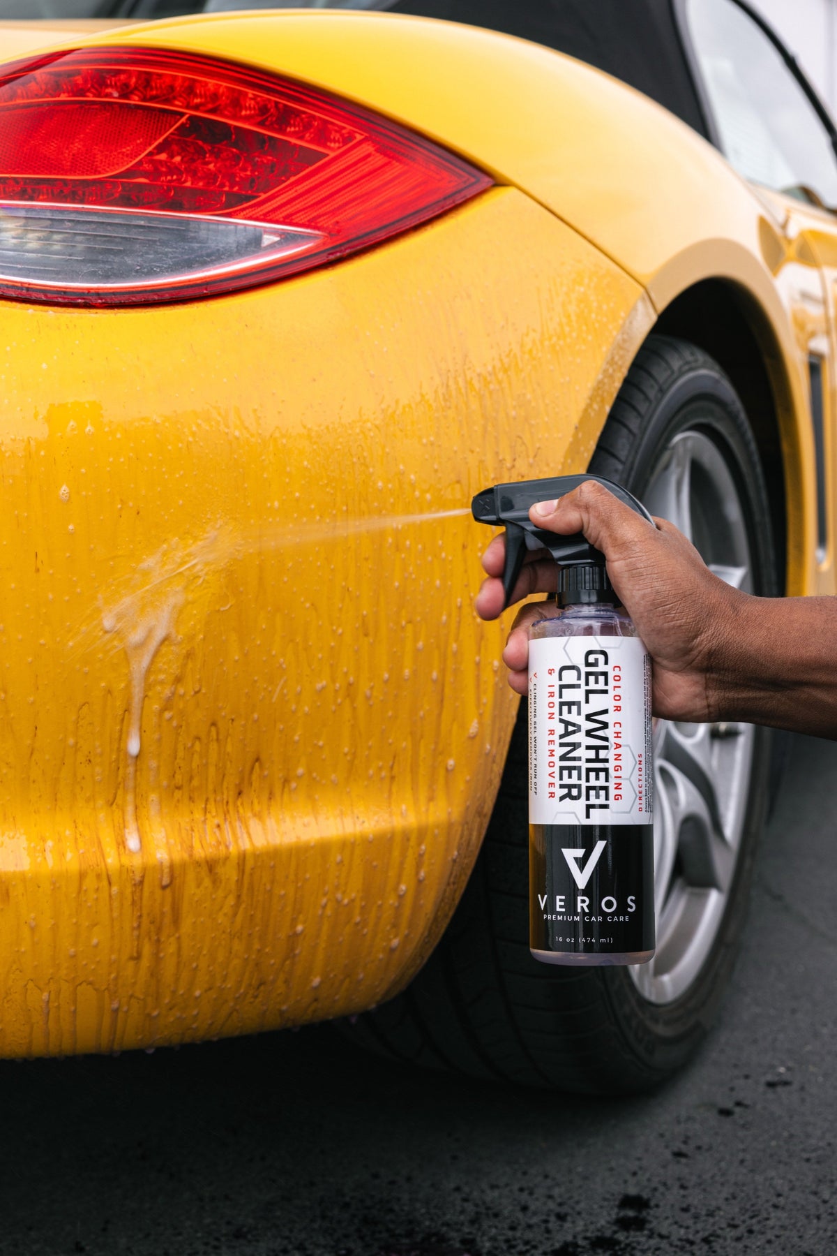 Spraying Gel Wheel Cleaner on paint