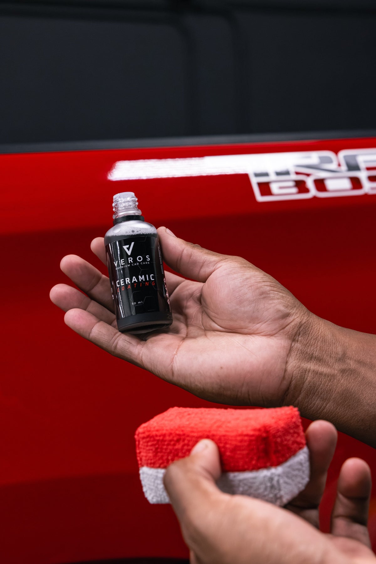 5 Year Ceramic Coating and applicator in hand