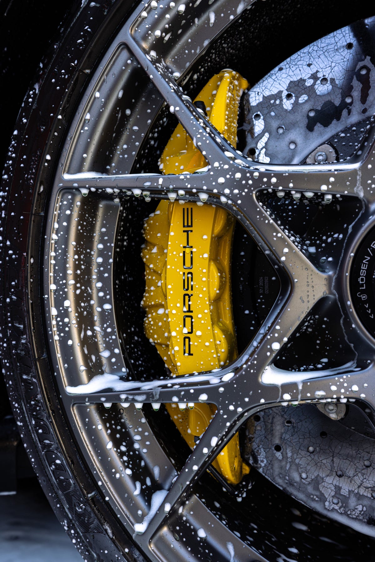 Suds on a Porsche brake caliper